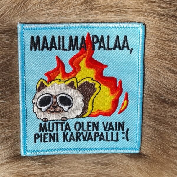 Maailma palaa, kangasmerkki